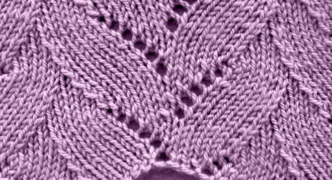 Finished falling leaves lace knitting pattern in lavender yarn, showing overlapping leaf shapes with eyelet detail